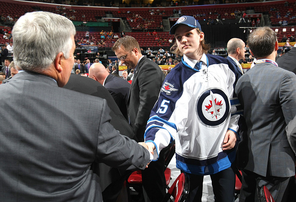 SUNRISE, FL - JUNE 27:  Sami Niku shakes hands with a member of the Winnipeg Jets draft team after being selected 198th overall by the Winnipeg Jets during the 2015 NHL Draft at BB&T Center on June 27, 2015 in Sunrise, Florida.  (Photo by Dave Sandford/NHLI via Getty Images)